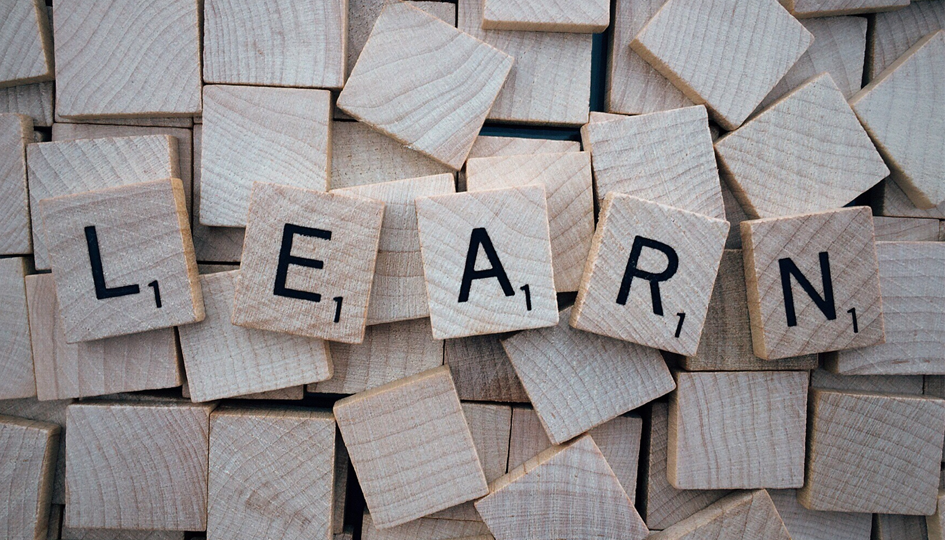 Scrabble tiles that spell 'learn' | Professional Development Event | Benefits by Design