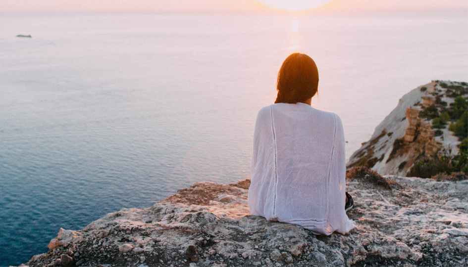 Woman overlooking the sea | Managing Mental Health | Benefits by Design