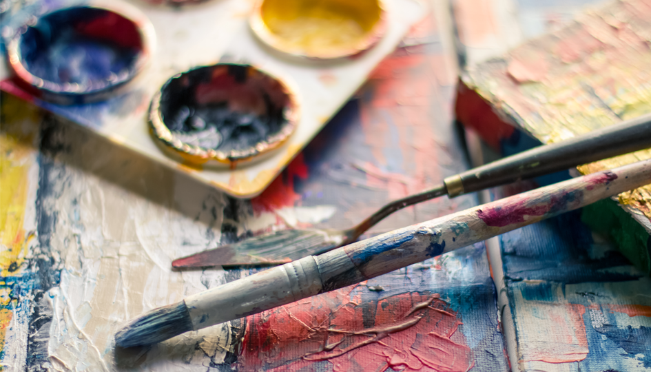 Paint brushes overtop of a painting | PSA | Benefits by Design