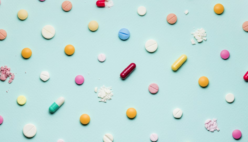Prescription pills on a blue background
