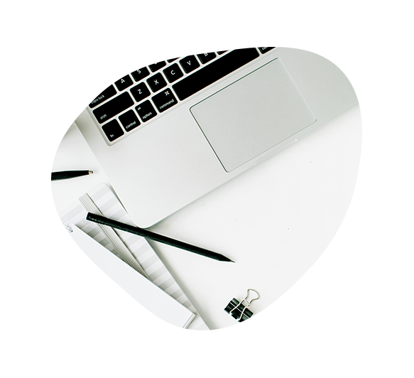 Laptop with a pen resting on the trackpad