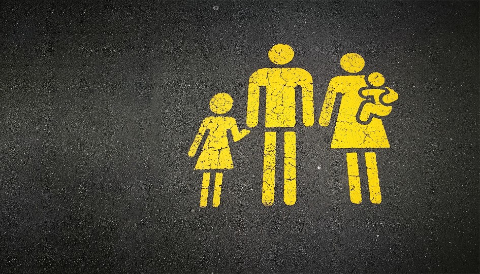 Images of a man, woman, child on the pavement, similar to a crosswalk. | Life Insurance | Benefits by Design