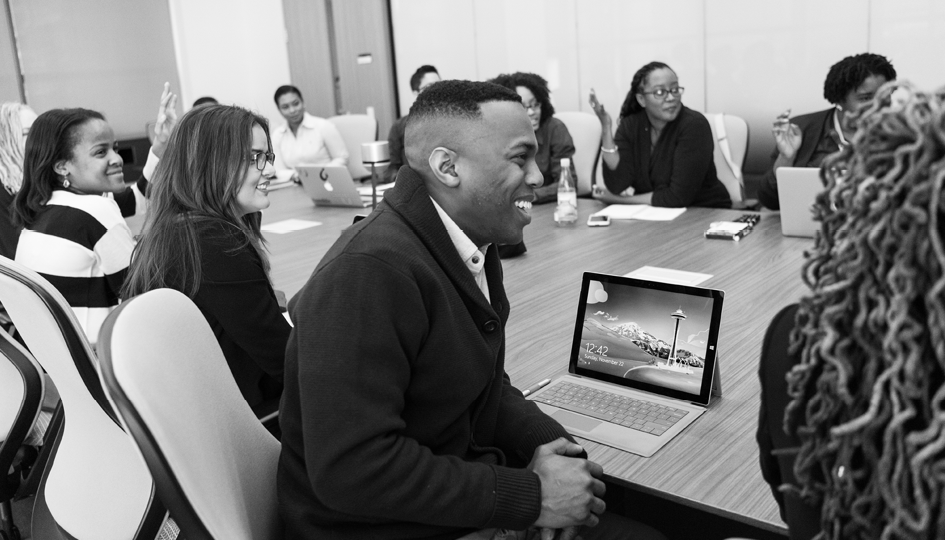 People sitting at a table | Professional Development | Benefits by Design