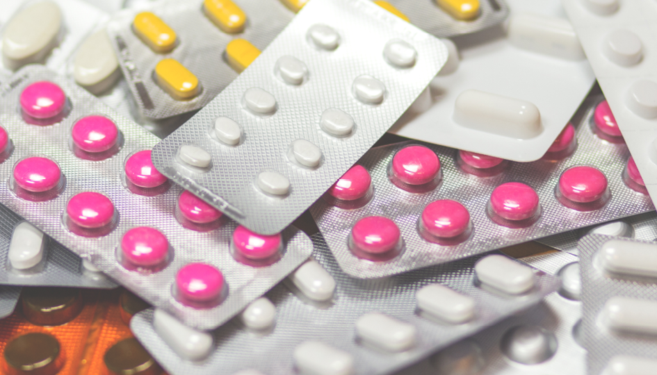 Several packages of pills stacked on top of each other | Biosimilar Drug | Benefits by Design
