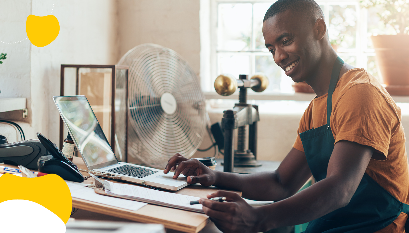 Man using tablet on a desk | Benefits funding options | Benefits by Design|