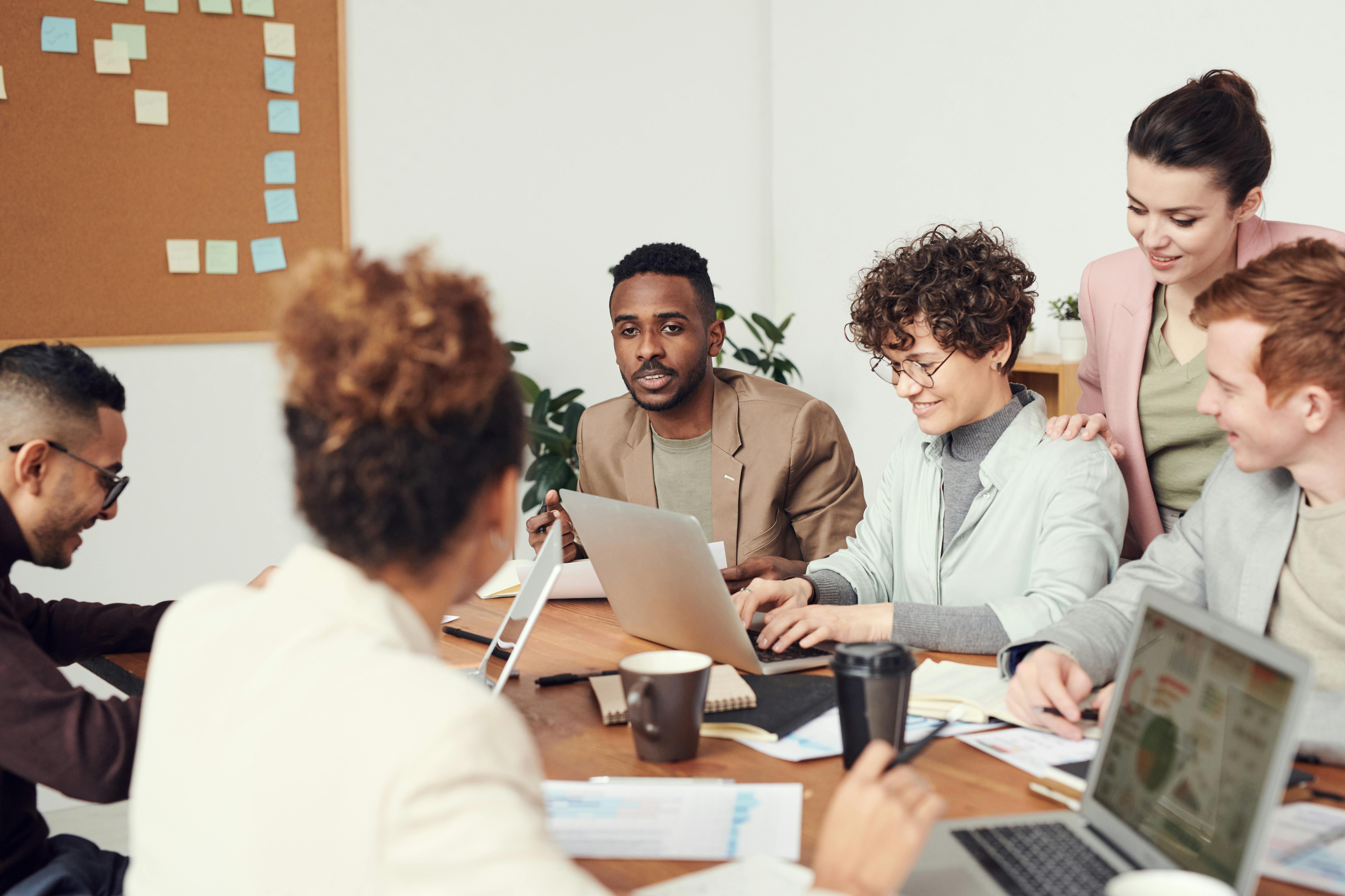 People in a meeting talking about flexible work arrangements.
