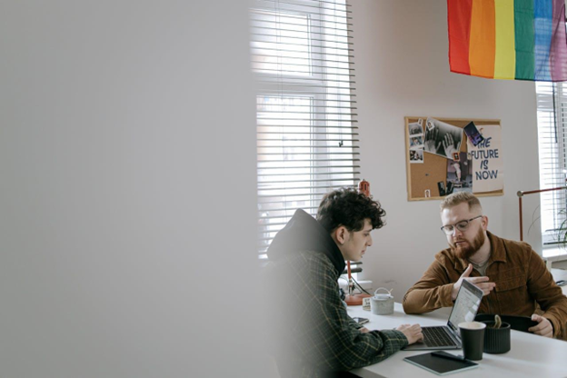 Colleagues talking in an office.