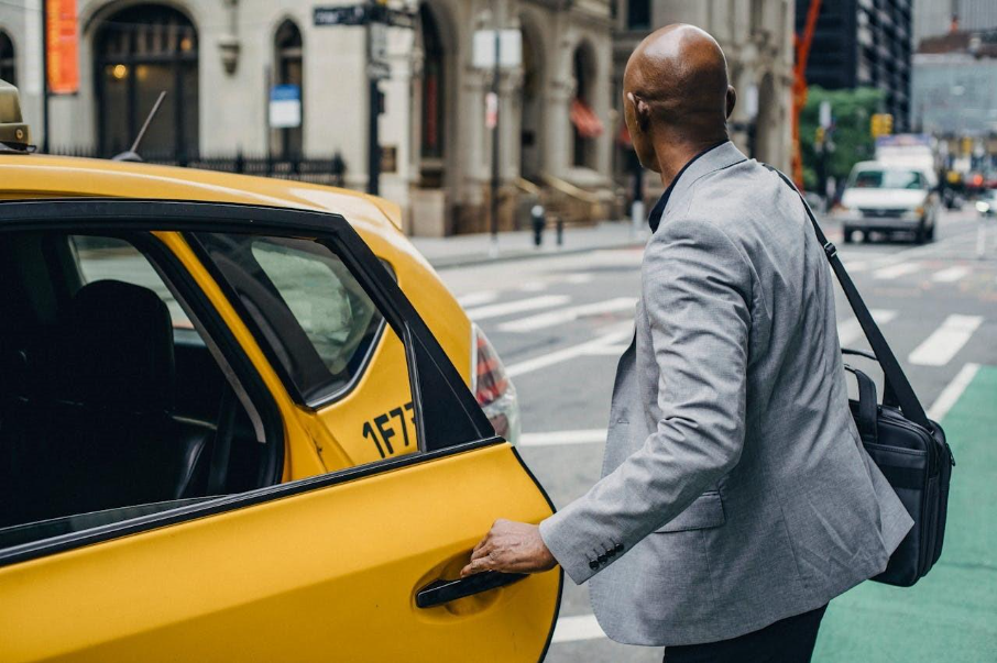 a businessman taking a taxi 