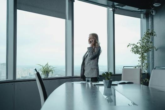 a woman talking on the phone in an office